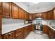 An eat-in kitchen features wood cabinets, stainless steel appliances and white subway tile back splash at 578 Circle Dr., Myrtle Beach, SC 29575