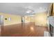 Open-concept living space featuring laminate floors, a fireplace, and abundant natural light at 578 Circle Dr., Myrtle Beach, SC 29575