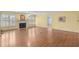 Spacious living room featuring laminate floors, a fireplace, and abundant natural light at 578 Circle Dr., Myrtle Beach, SC 29575