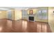 Spacious living room featuring laminate floors, a fireplace, and abundant natural light at 578 Circle Dr., Myrtle Beach, SC 29575