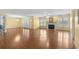 Spacious living room featuring laminate floors, a fireplace, and abundant natural light at 578 Circle Dr., Myrtle Beach, SC 29575