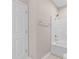 Bathroom with white tile tub and shower at 5870 Longwood Dr. # 201, Murrells Inlet, SC 29576