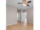 Bright bedroom with wood-look floors, neutral walls, and view to the outside at 5870 Longwood Dr. # 201, Murrells Inlet, SC 29576