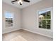 Bright bedroom featuring wood-look floors and two large windows at 5870 Longwood Dr. # 201, Murrells Inlet, SC 29576