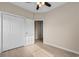 Bedroom featuring a closet with double doors and a ceiling fan at 5870 Longwood Dr. # 201, Murrells Inlet, SC 29576