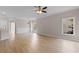 Inviting living room with hardwood floors, a ceiling fan, and stylish lighting creating a cozy and bright ambiance at 5870 Longwood Dr. # 201, Murrells Inlet, SC 29576