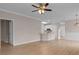 Open-concept living space with hardwood floors, modern ceiling fan, and neutral paint tones providing a welcoming atmosphere at 5870 Longwood Dr. # 201, Murrells Inlet, SC 29576