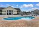 Community pool surrounded by lounge chairs provides an inviting oasis for residents at 5870 Longwood Dr. # 201, Murrells Inlet, SC 29576