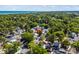 A high-angle view shows lush treetops surrounding a property close to the ocean at 6001 - 1842 S Kings Hwy., Myrtle Beach, SC 29575