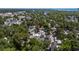 A high-angle shot shows a home amid lush trees in a neighborhood with a clear view of the sea at 6001 - 1842 S Kings Hwy., Myrtle Beach, SC 29575