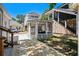 Relaxing backyard with stone landscaping, outdoor seating, and a screened in porch for outdoor gatherings at 6001 - 1842 S Kings Hwy., Myrtle Beach, SC 29575