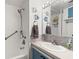 Compact bathroom with a shower, vanity, and decorative fish accents, offering a functional and charming space at 6001 - 1842 S Kings Hwy., Myrtle Beach, SC 29575
