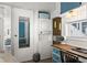 Efficient laundry area with stacked washer and dryer, plus built-in desk and storage at 6001 - 1842 S Kings Hwy., Myrtle Beach, SC 29575