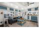 Living room with view into the kitchen area, modern furniture, and bright natural light at 6001 - 1842 S Kings Hwy., Myrtle Beach, SC 29575