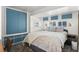 Serene bedroom with a plush bed, blue accents, and ample closet space, creating a relaxing retreat at 6001 - 1842 S Kings Hwy., Myrtle Beach, SC 29575