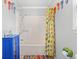 Clean bathroom featuring a bathtub and shower combination, complemented by whimsical flip-flop decorations at 6001-1643 S Kings Hwy., Myrtle Beach, SC 29575