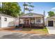 Inviting home showcasing a charming porch, playful decor, and vibrant pink doors that add a splash of color at 6001-1643 S Kings Hwy., Myrtle Beach, SC 29575