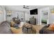 Comfortable living room with stylish furniture, a ceiling fan, and a glimpse into the cozy bedroom at 6001-1643 S Kings Hwy., Myrtle Beach, SC 29575