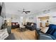 Well-lit living room with stylish decor, comfortable seating, and an open layout leading to the kitchen at 6001-1643 S Kings Hwy., Myrtle Beach, SC 29575