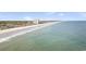 Scenic aerial view of a sprawling beach with crystal-clear water, oceanfront homes, and a high-rise hotel at 6001-Z67 S Kings Hwy., Myrtle Beach, SC 29575