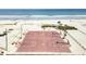 Aerial view of outdoor basketball courts on a beach, with palm trees and ocean backdrop at 6001-Z67 S Kings Hwy., Myrtle Beach, SC 29575