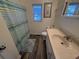 Cozy bathroom featuring wood flooring, a sink, a toilet, and a shower with blue curtain at 6001-Z67 S Kings Hwy., Myrtle Beach, SC 29575
