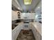 Bright white kitchen with updated appliances, ample counter space, and a cozy, functional design at 6001-Z67 S Kings Hwy., Myrtle Beach, SC 29575