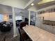 Open concept living room with decorative pillars, modern furnishings and a beachy, inviting atmosphere at 6001-Z67 S Kings Hwy., Myrtle Beach, SC 29575