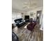 Comfortable living room with ceiling fan, inviting seating, and wood-look flooring at 6001-Z67 S Kings Hwy., Myrtle Beach, SC 29575