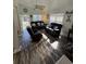 Inviting living room with leather sofas, wood-look floors, lots of natural light and white columns at 6001-Z67 S Kings Hwy., Myrtle Beach, SC 29575