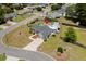 An aerial view showcases the home's layout, pool area, landscaping, and neighborhood location at 601 Jousting Ct., Conway, SC 29526