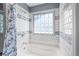 Bright bathroom featuring subway tile and glass block window at 601 Jousting Ct., Conway, SC 29526