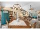 Cozy dining area with a unique light fixture and bright, airy atmosphere at 601 Jousting Ct., Conway, SC 29526