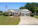 Charming home featuring a beautifully landscaped front yard, inviting entryway and brick accents at 601 Jousting Ct., Conway, SC 29526
