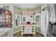 Bright kitchen nook featuring a wooden island with storage and natural light from large bay windows at 601 Jousting Ct., Conway, SC 29526