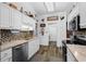 Functional kitchen with stainless steel appliances, wood-look flooring, and ample cabinet space at 601 Jousting Ct., Conway, SC 29526