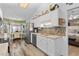 Spacious kitchen featuring stainless steel appliances, mosaic backsplash, and wood-look flooring at 601 Jousting Ct., Conway, SC 29526