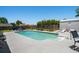 Outdoor pool area featuring a well-maintained pool, lounge chairs, and landscaping at 601 Jousting Ct., Conway, SC 29526