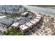 A stunning aerial view of a condo complex featuring resort-style amenities including a sparkling pool and tennis court at 6309 N Ocean Blvd. # 14 E, North Myrtle Beach, SC 29582
