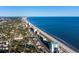 Overhead shot of a coastal city showcasing the shoreline, ocean, and neighborhood at 6309 N Ocean Blvd. # 14 E, North Myrtle Beach, SC 29582