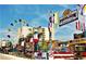 Vibrant amusement park with Ferris wheel, colorful rides, and food vendors, offering Gathering entertainment at 6309 N Ocean Blvd. # 14 E, North Myrtle Beach, SC 29582