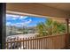 Balcony with seating and a view of a tree, parking area and residential area at 6309 N Ocean Blvd. # 14 E, North Myrtle Beach, SC 29582