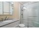 Bathroom featuring a vanity with granite countertop and enclosed shower with glass doors at 6309 N Ocean Blvd. # 14 E, North Myrtle Beach, SC 29582