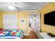 Bedroom with a ceiling fan, a door to the hallway, and a built-in wardrobe at 6309 N Ocean Blvd. # 14 E, North Myrtle Beach, SC 29582