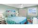 Cozy bedroom with a queen-sized bed and beachy decor, offering a serene retreat at 6309 N Ocean Blvd. # 14 E, North Myrtle Beach, SC 29582