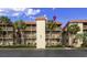 Three story beach condo featuring multiple balconies, lush landscaping, and ample parking at 6309 N Ocean Blvd. # 14 E, North Myrtle Beach, SC 29582