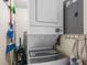 Laundry room with stacked washer and dryer, with cleaning supplies at 6309 N Ocean Blvd. # 14 E, North Myrtle Beach, SC 29582