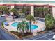 Charming condo complex features a sparkling pool surrounded by lush landscaping and comfortable lounge areas at 6309 N Ocean Blvd. # 14 E, North Myrtle Beach, SC 29582