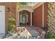 Inviting front entryway with brick pathway and pillars framing a decorative glass door and arched window at 806 Compass Point Dr., North Myrtle Beach, SC 29582