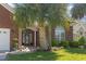 Charming brick home featuring a well-manicured lawn, lush landscaping, and inviting front entrance at 806 Compass Point Dr., North Myrtle Beach, SC 29582